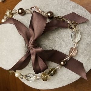 Creative earth tone beaded necklace with bowtie